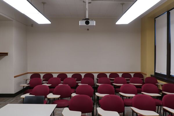 Rear of room view of student tablet arm chair seating