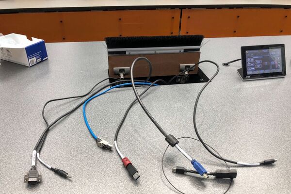 Pedestal - laptop cable connections with cables pulled out showing cable ends