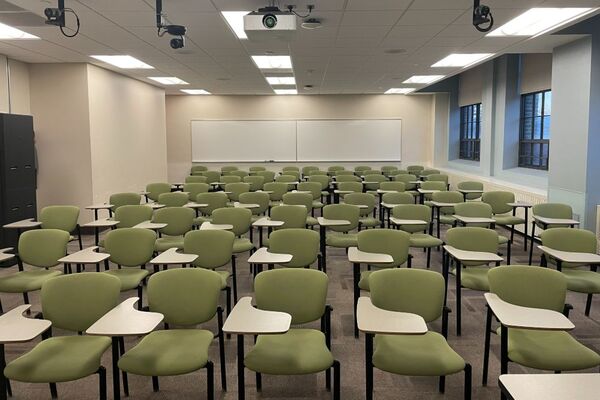 Back of room view of student tablet arm seating and markerboard on back wall