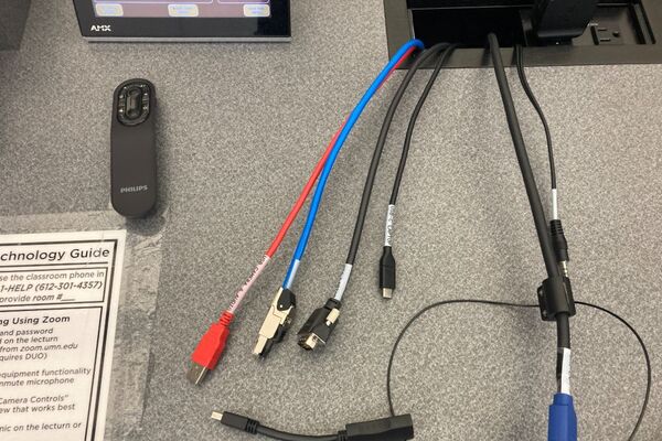 Pedestal - laptop cable connections with cables pulled out showing cable ends