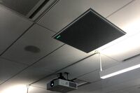 A 2¿ x 2¿ tile mounted to the ceiling to provide microphone coverage over student seating