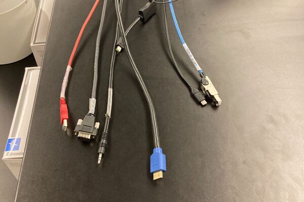 Pedestal - laptop cable connections with cables pulled out showing cable ends