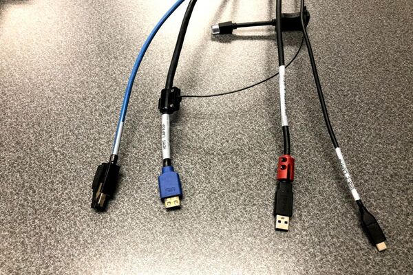 Pedestal - laptop cable connections with cables pulled out showing cable ends