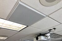 White 2¿ x 2¿ tile mounted in the ceiling to provide microphone coverage over student seating