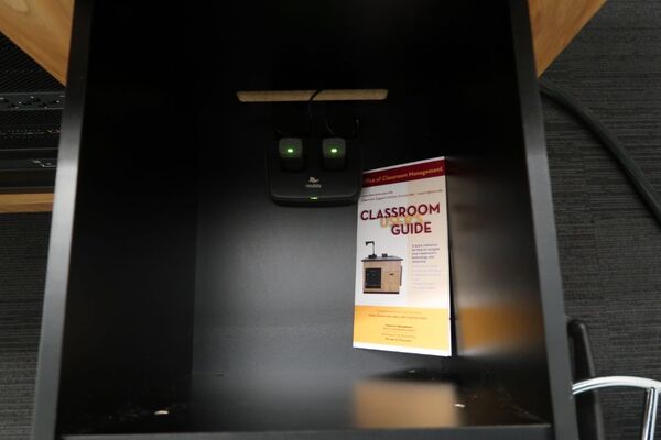 Pedestal - inside view of drawer showing two wireless mics in charging base