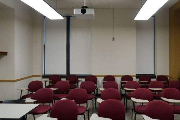 Rear of room view of student tablet arm chair seating