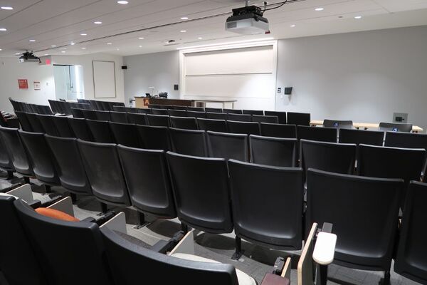 Front of room view with lectern and demonstration bench at left side of room