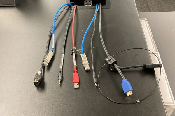 Pedestal - laptop cable connections with cables pulled out showing cable ends