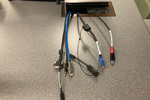 Pedestal - laptop cable connections with cables pulled out showing cable ends